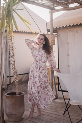 a lady in a printed silk dress with lantern sleeves